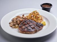 W204D. Chargrilled Ribeye With Black Pepper Sauce + 2 Sides